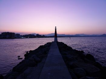 Scenic view of sea against sky at sunset