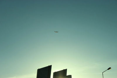 Low angle view of airplane flying in sky