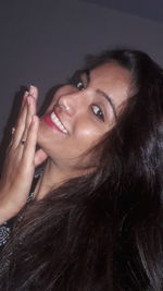 Close-up portrait of a smiling young woman