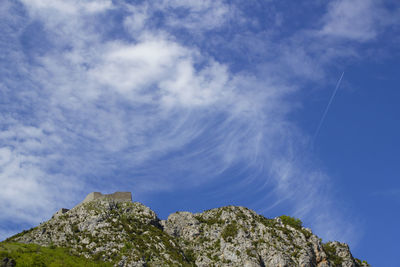 Low angle view of rock formation against sky