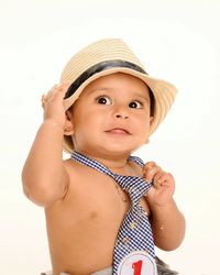 Cute shirtless baby boy wearing hat and necktie against white background
