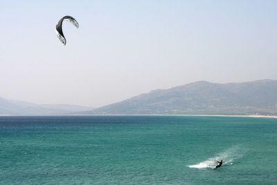 Kitesurfing view of sea against clear sky