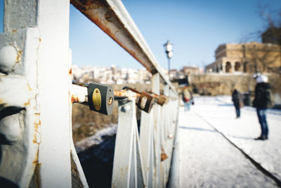 Close-up of padlocks on railing