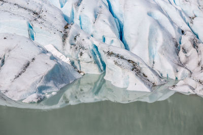 High angle view of glacier by lake at lyngen alps