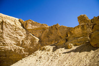 Scenic view of rocky mountains against clear sky