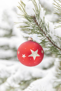 Close-up of christmas decorations on snow