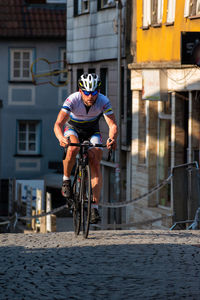 Man riding bicycle in city