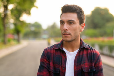 Portrait of young man standing outdoors