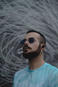 Portrait of young man wearing sunglasses