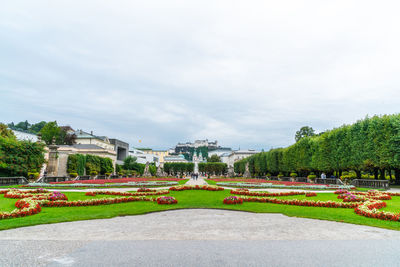 View of formal garden with building in background