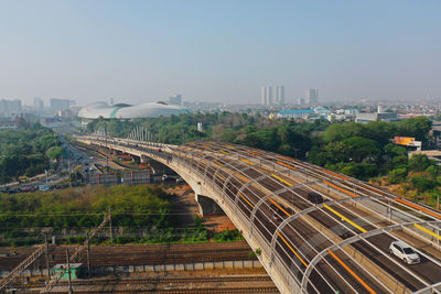 High angle view of train in city against sky