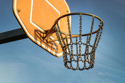 Low angle view of basketball hoop against sky