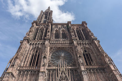 Low angle view of cathedral against cloudy sky