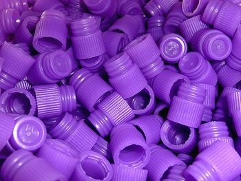 Full frame shot of purple test tube lids