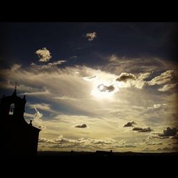 Low angle view of cloudy sky at sunset