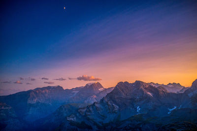 Scenic view of mountains against sky during sunset
