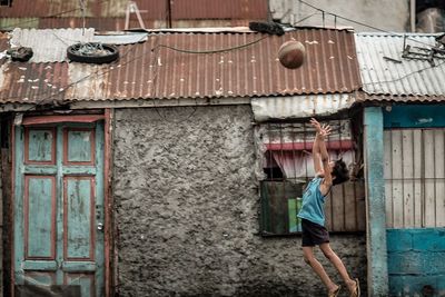 Man standing outside house