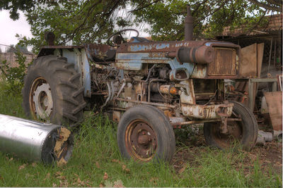 Abandoned vehicle on field