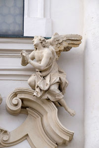 Close-up of statue against white wall