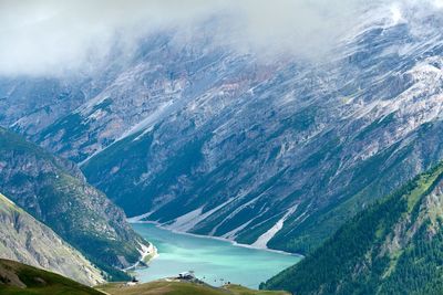 Scenic view of river amidst mountains