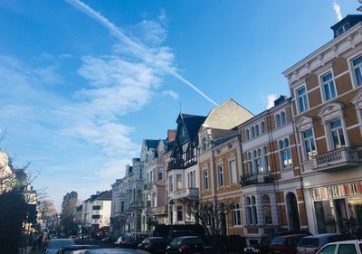 Low angle view of buildings against blue sky