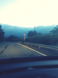 Country road leading towards mountains