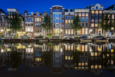 Buildings in city at dusk