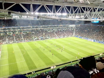 Group of people on soccer field at night