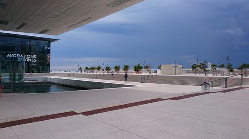 View of buildings against cloudy sky