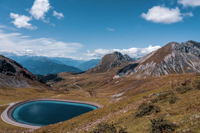 Scenic view of snowcapped mountains against blue sky