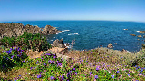 Scenic view of sea against blue sky