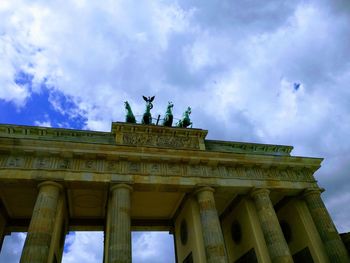 Low angle view of statue against cloudy sky