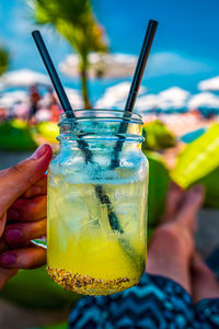 Close-up of hand holding drink