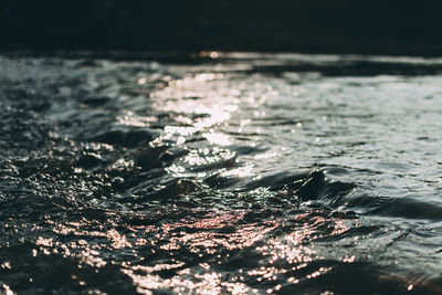 Close-up of water drops on sea shore