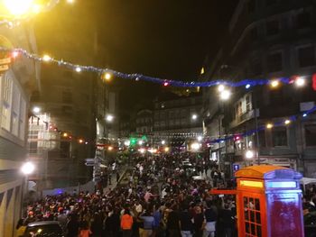 Crowd on illuminated city at night