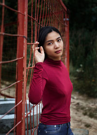 Portrait of young woman standing outdoors