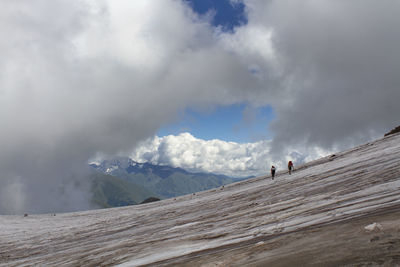 Scenic view of snow covered mountain against sky