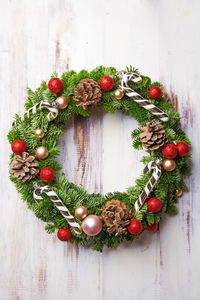 Close-up of wreath on wood during christmas