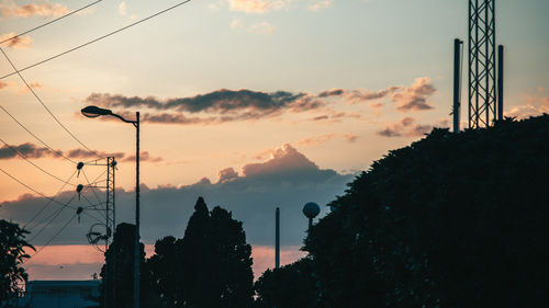 Silhouette trees against sky during sunset