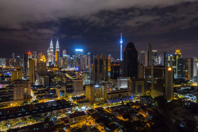 Aerial view of city lit up at night