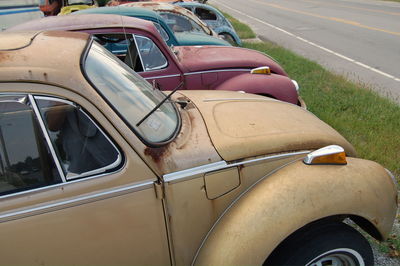 Abandoned vintage cars at junkyard