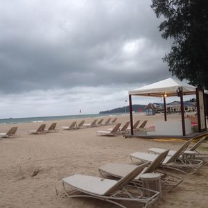 View of beach against cloudy sky