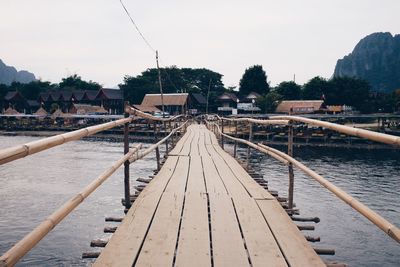 Wooden pier over river in town