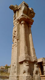 Low angle view of historic building against clear blue sky