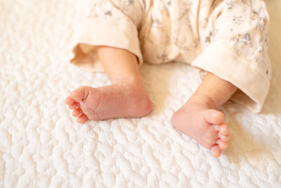 Low section of baby feet