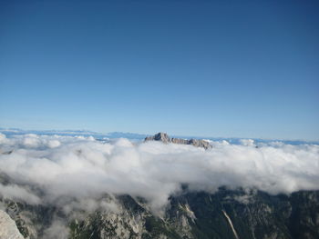 Scenic view of landscape against blue sky