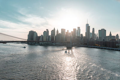 Sunset over east river and financial district manhattan, nyc. view of brooklyn bridge