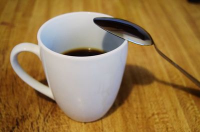 Close-up of coffee cup on table