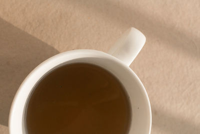 High angle view of coffee cup on table