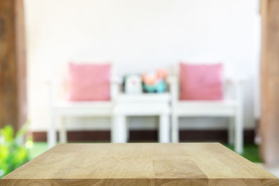 Close-up of empty chairs on table